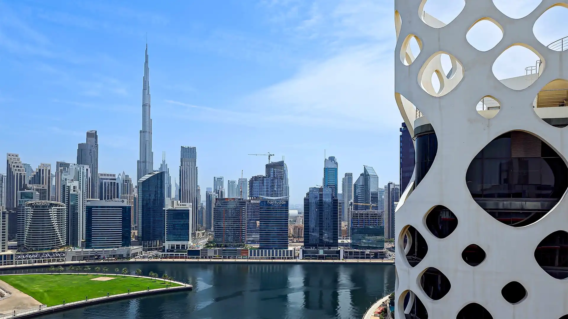 O14 building exterior with Business Bay canal and Burj Khalifa city view