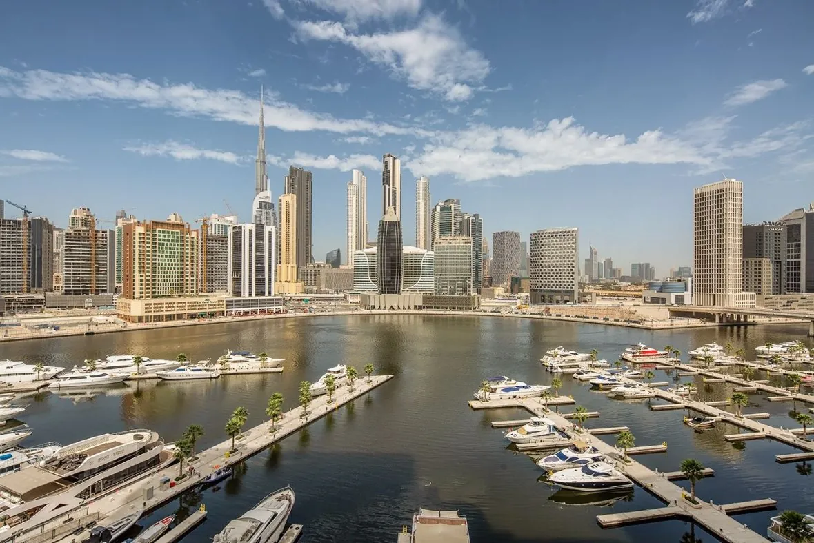 Yacht marina in Business Bay with skyline backdrop and Burj Khalifa