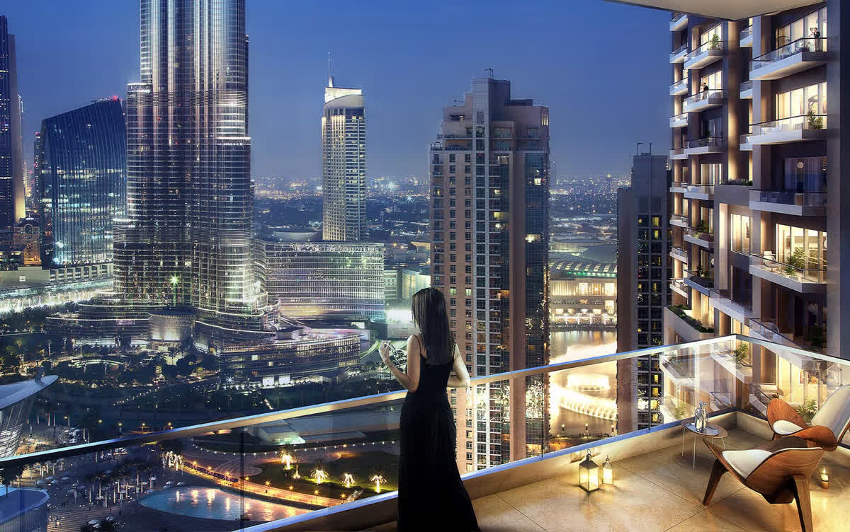 Family enjoying Burj Khalifa view from Downtown apartment balcony